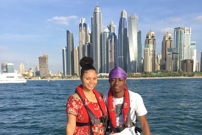 90-Min Speed Boat: Burj Al Arab, Atlantis, Ain Dubai & Ice Cream! - Dubai Marina Mall and the skyline glow