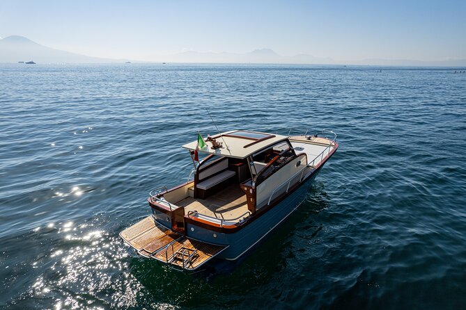 Capri Island Private Luxury Boat – Exclusive Scenic Day Tour - Capri from the water: grottos, Faraglioni, and the full ring of the island