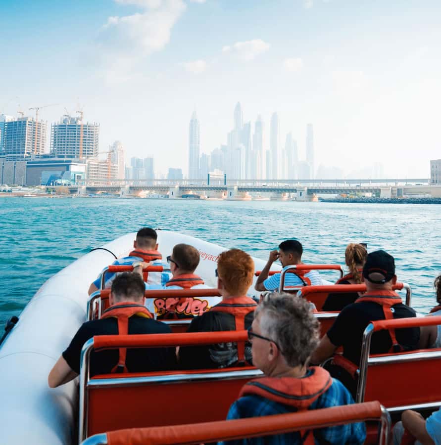 Dubai: Marina, Atlantis, Palm & Burj Al Arab Speedboat Tour - Dubai Highlights With a Human Touch: Guides, Music, and Facts