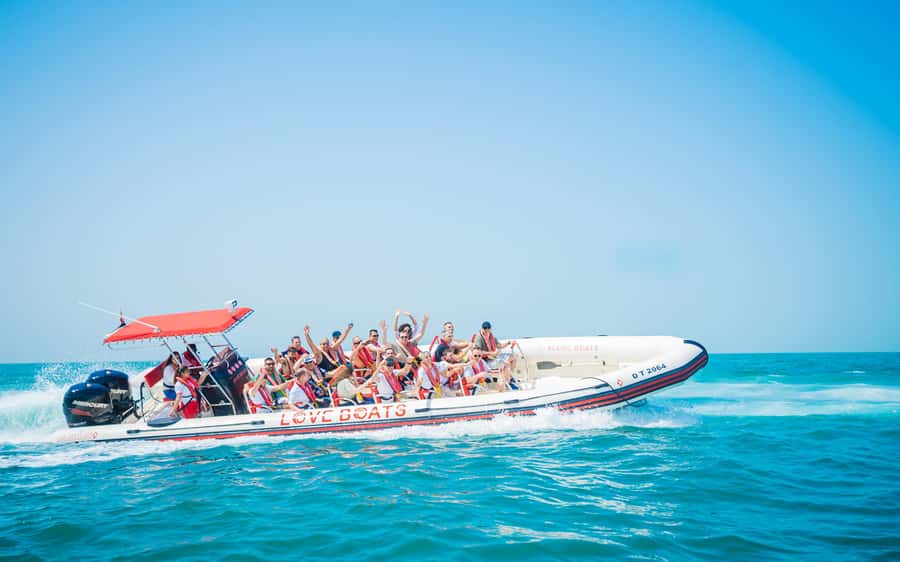 Dubai: Sightseeing Speedboat Tour with Live Tour Guide - Dubai Marina Lagoon to the Palm: the ride feel and pacing