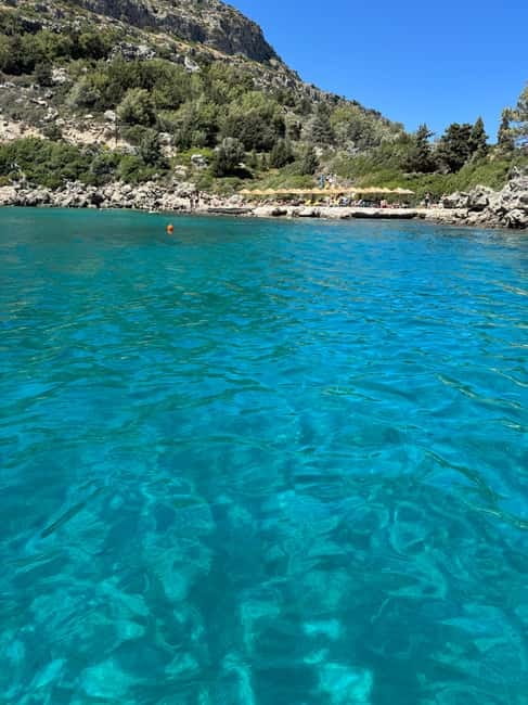 From Faliraki : Speedboat tour kalithea caves&antony kouin - Antony Queen Bay snorkeling: calm water, rocky bottom, and real fish odds