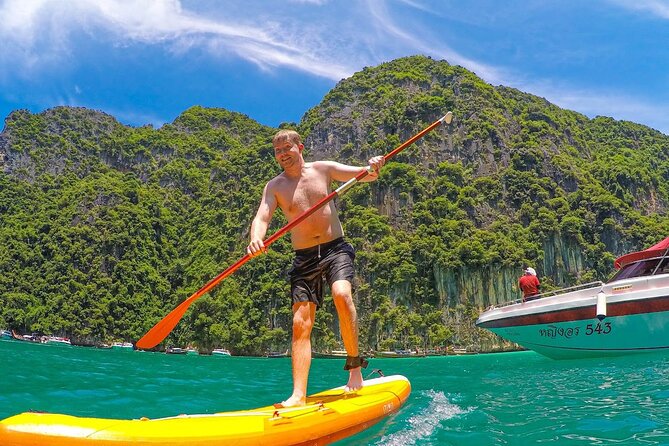 Phi Phi & Khai Islands Speedboat Tour from Phuket with Snorkeling - Monkey Beach: quick photos and a real-life animal moment