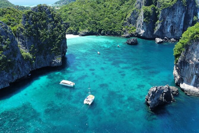 Phi Phi, Maya and Bamboo Islands Day Tour by Speedboat in Krabi - Getting Onboard: Pickup, Tickets, and What to Expect at the Pier