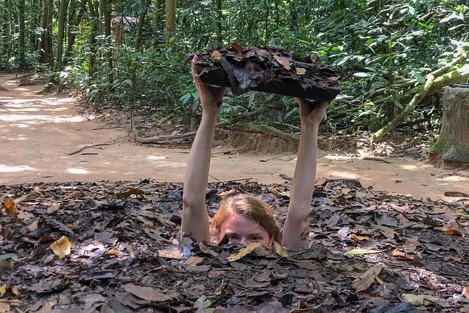 Private Half Day Cu Chi Tunnels Tour by AC Car or Speedboat - Entering the tunnels: traps, hospitals, and hidden rooms
