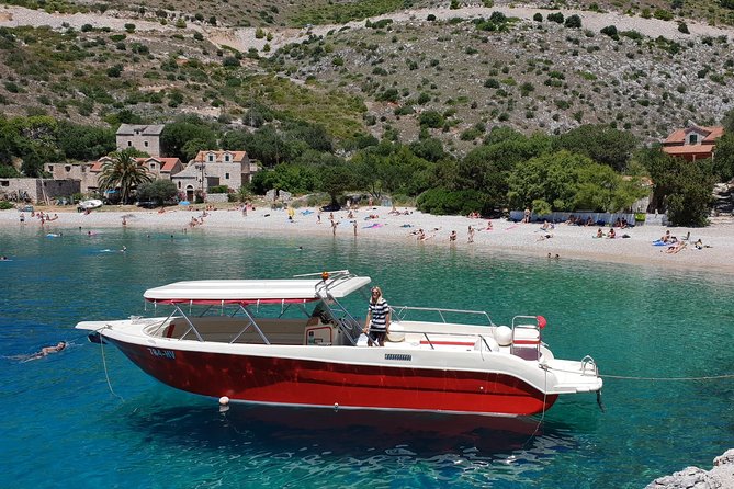 Private Red Rocks and Pakleni Islands beach hopping speedboat tour - Dubovica Beach and the Red Rocks of Hvar: The Swim-Under-Cliffs Moment