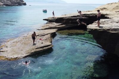 Sea Safari Speedboat Trip in Corfu. Island hopping Sea Tour - Diaplo Island: quiet feel, sandy cliffs, and optional cliff jumps
