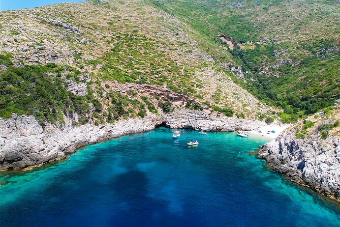 Vlore Speedboat Tour to Dafina Bay & Haxhi Ali Cave - Dafina Bay: mountains, swim time, and clear water
